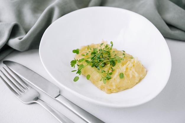 Bowl with tasty mashed potatoes on top view