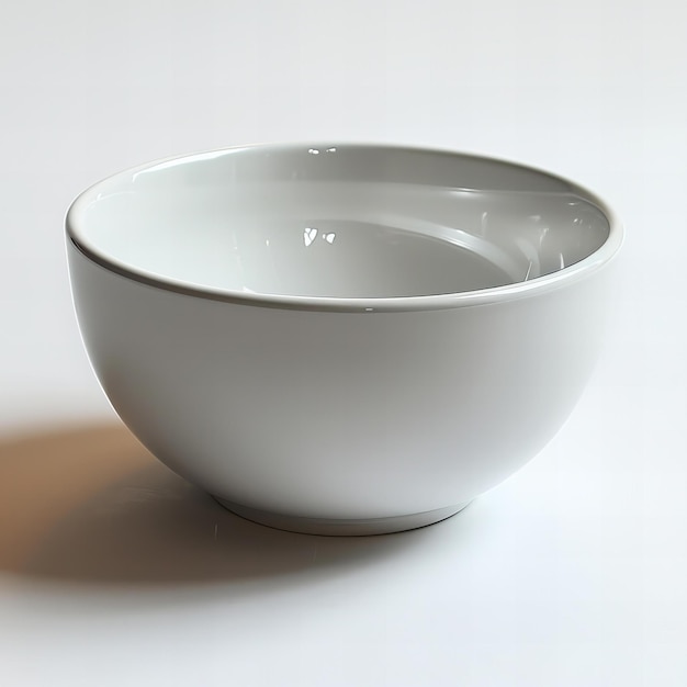 a bowl with a water drop on it is on a white surface