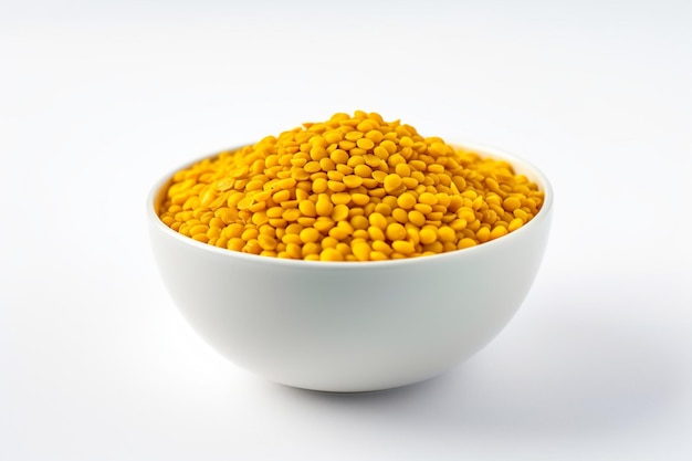 Bowl of yellow mung beans on a white background