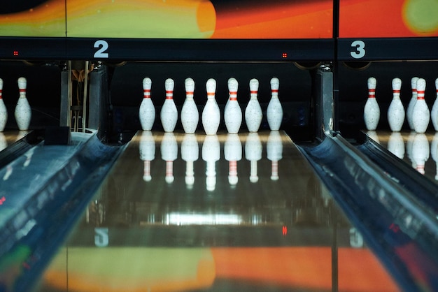 Bowling pins reflecting in bowling alley lane