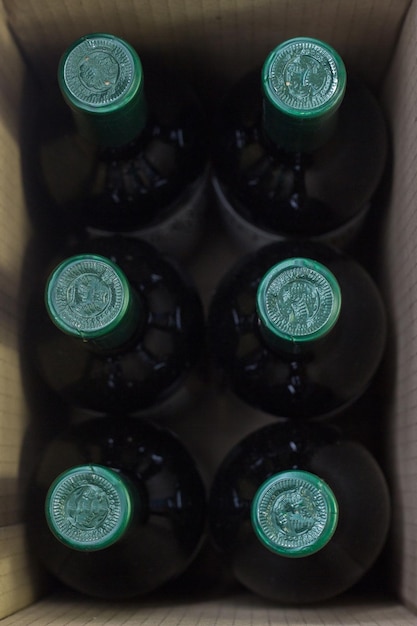 A box of bottles with a green label that says " the word " on it.