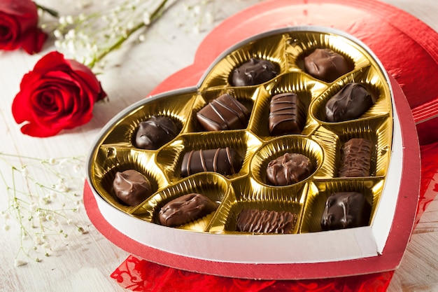 Box of chocolates with red flower