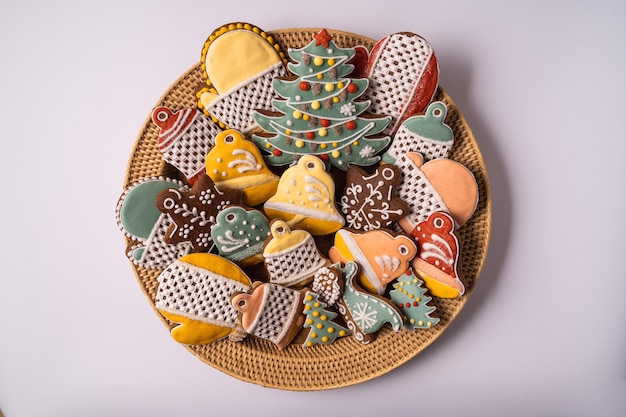 A box of Christmas Gingerbread and decorations on wooden brown background,flat lay.