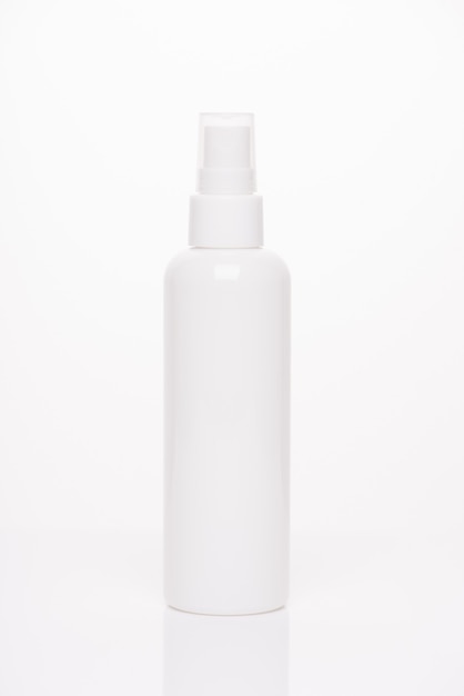 Box container balm branding concept. Vertical photo of pump fresh clear bottle of lotion isolated over white background