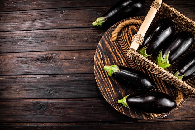 Box on a table with ripe eggplant