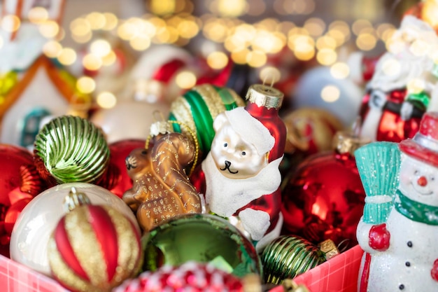 Box of vintage christmas ornaments with golden bokeh on background stock image