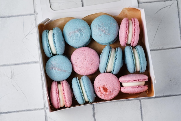 A box with classic French macarons Delicious and beautiful cakes