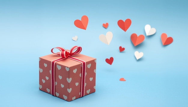 a box with hearts and a red bow on it