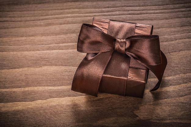 Boxed glittery gift container on vintage wooden board