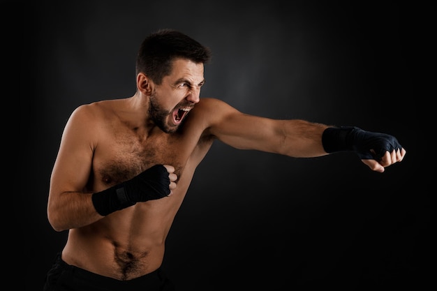 Boxer throwing a fierce and powerful punch