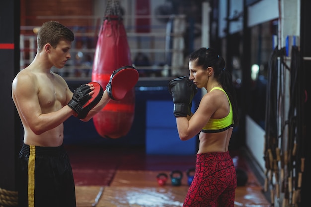 Boxers using focus mitts during training