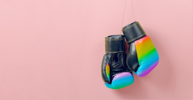 Boxing gloves in the colors of the LGBT rainbow flag Fight for your rights concept Template Copy space for text mockup