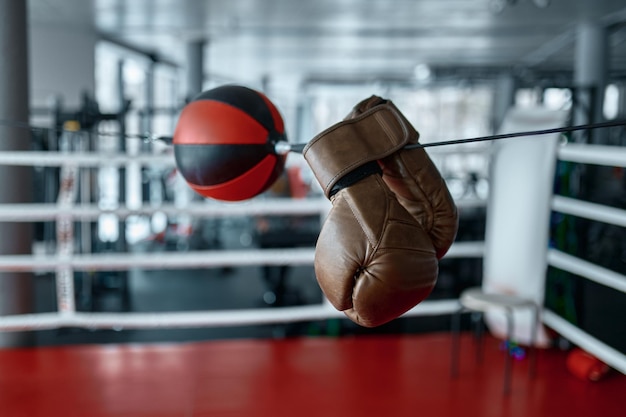 Boxing gloves hanging on speed punching ball