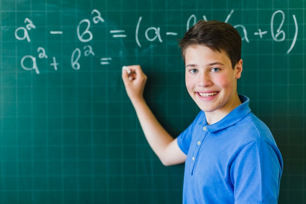 Boy calculating and posing