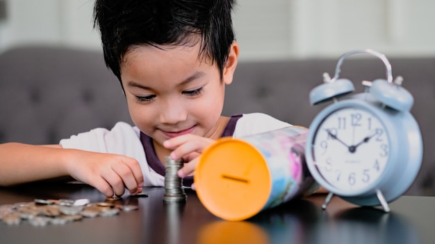 Boy collecting money or counting his savings