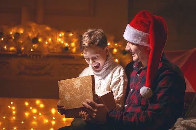 boy and dad opening a present