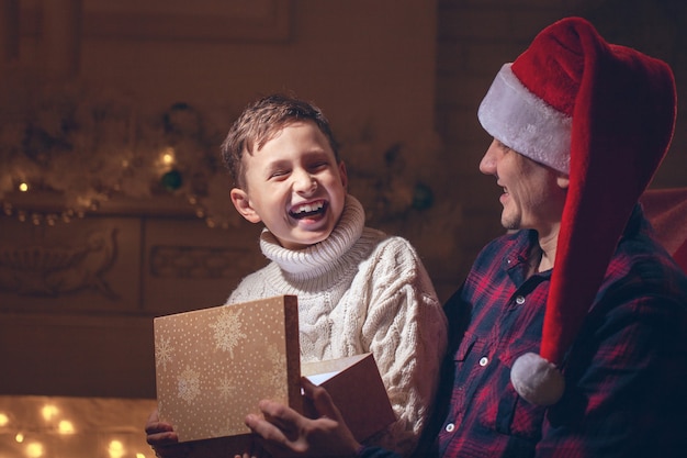 boy and dad opening a present