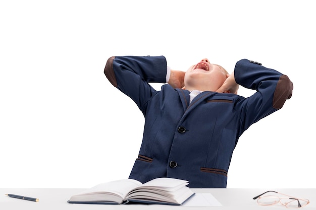 Photo boy does his homework by grabbing head and screaming in anger homeschooling lots of lessons