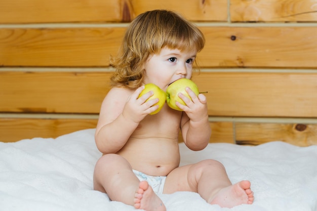 Boy eating apples