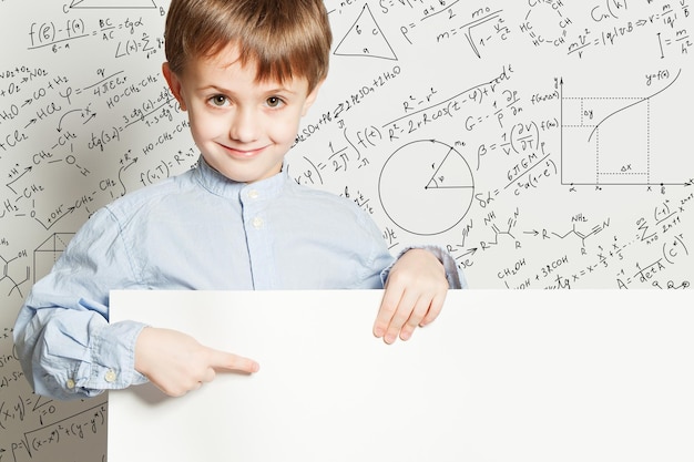 Boy and empty billboard School concept with math formulas