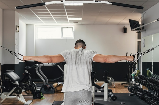 Boy exercising in the gym. Healthy habits