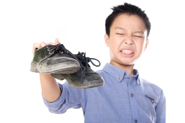 Boy feeling unhappy with bad smell white sock