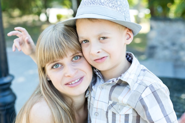 A boy and a girl are hugging.