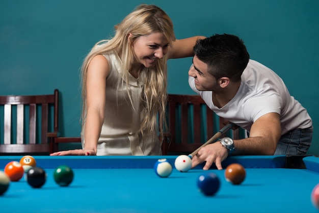 Boy And Girl Flirting On A Pool Game