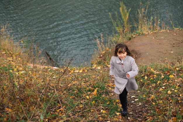 Boy and girl playing in winter forest