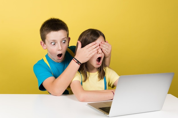 Boy and girl watching inappropriate content on internet