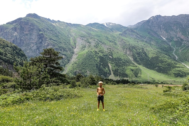 A boy in the gorge of the Cherek River in the vicinity of the Ushtulu tract Caucasus 2021