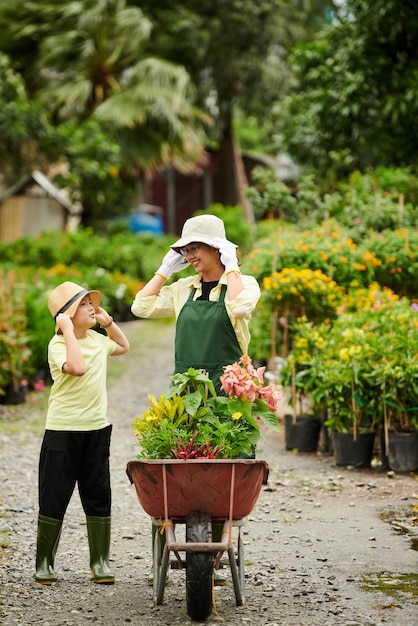 Boy Helping Mother with Work