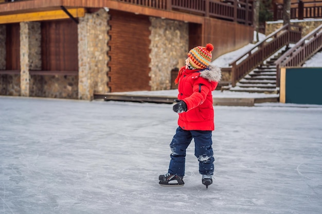 Boy ice skating for the first time