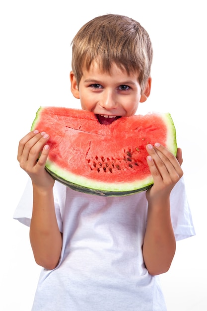 Boy is eating a watermelon