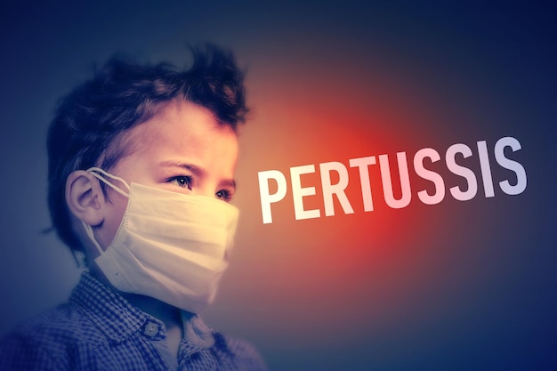 Boy in the medical mask covered his face with his hands next to inscription PERTUSSIS