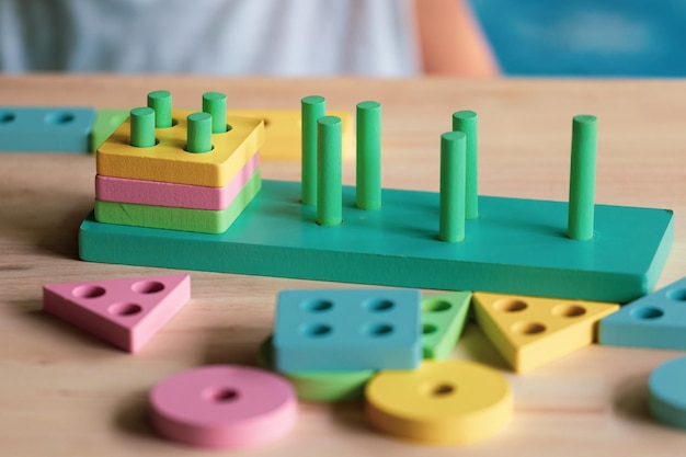 Boy playing children toys for learning for skills