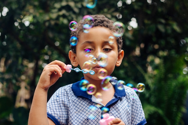 Boy playing soap bubble