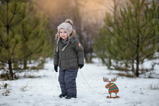 Boy playing with toy and having fun in winter