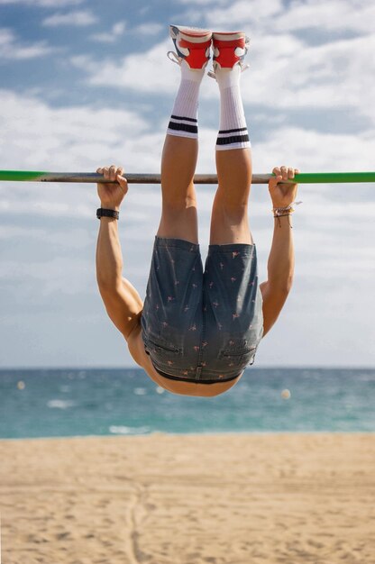 Boy practicing bar sport