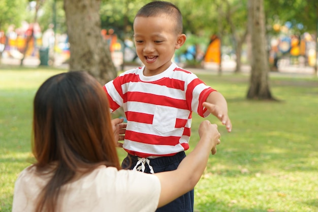 The boy ran to hug his mother