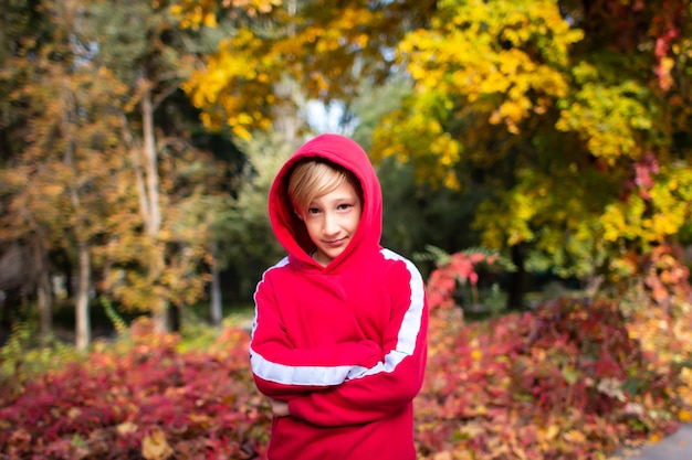 a boy in a red sweatshirt