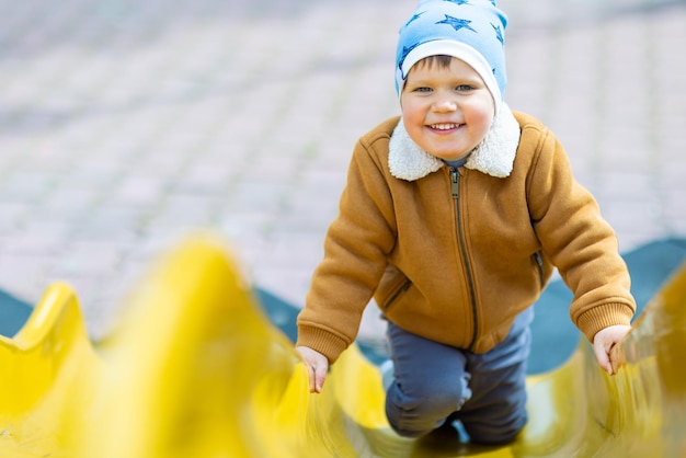 Boy riding downhill in autumn weather