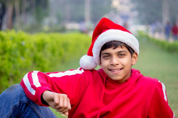 Boy in Santa claus hat portrait - winter holiday christmas concept
 