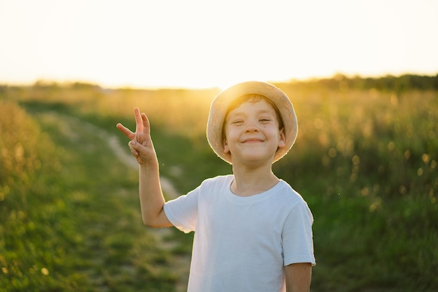 The boy shows with his fingers the number three or trident coat of arms of Ukraine Ukrainian statehood