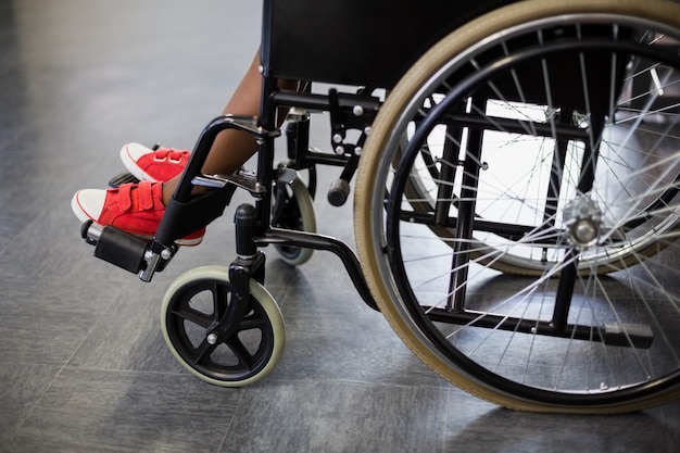 Boy sitting on wheelchair