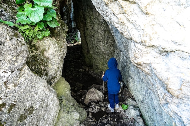 A boy in the Stone Bowl Gorge A gorge in the mountains of the landscape nature of Dagestan Russia