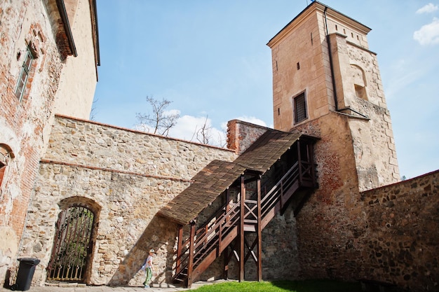 Boy walking in Veveri castle Czech Republic