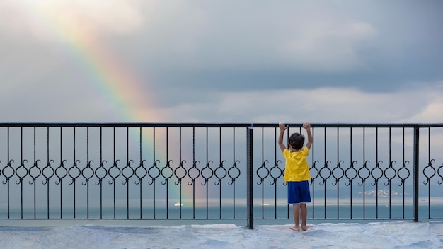 Boy watching rainbow