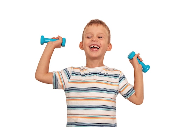 Boy on a white background laughs and raises dumbbells the child does not have a milk tooth