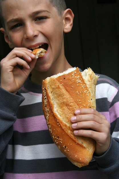 boy with bread in hand